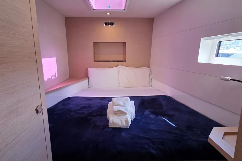 Slide: The Image of Luxurious bedroom interior of 2018 Fountaine Pajot Motor Yacht 44 with plush bedding. - 46