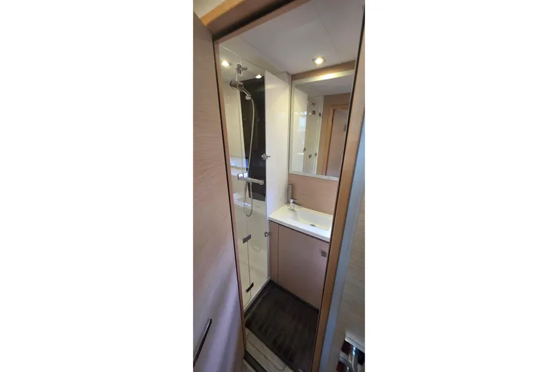 Slide: The Image of Luxurious bathroom in 2018 Fountaine Pajot Motor Yacht 44, featuring modern fixtures and elegant design. - 48