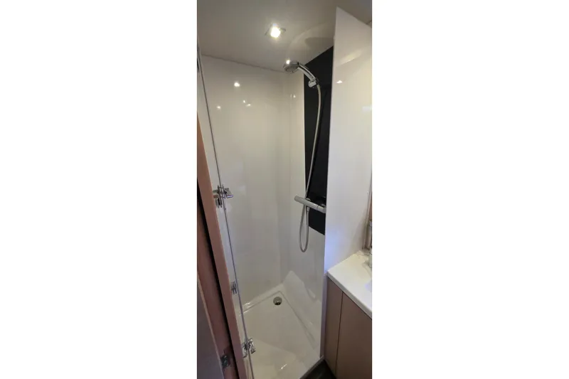 Slide: The Image of Shower area in 2018 Fountaine Pajot Motor Yacht 44, featuring modern fixtures and sleek design. - 49