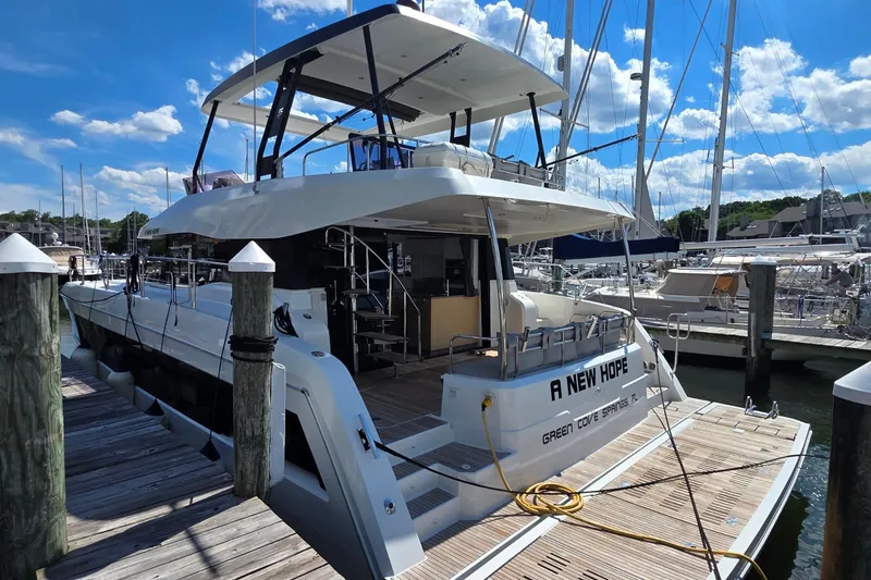 Slide: The Image of 2018 Fountaine Pajot Motor Yacht 44 docked at marina under blue sky. - 5