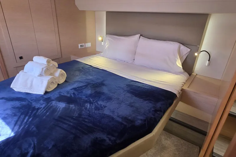 Slide: The Image of Luxurious bedroom interior of 2018 Fountaine Pajot Motor Yacht 44 with plush bedding. - 51