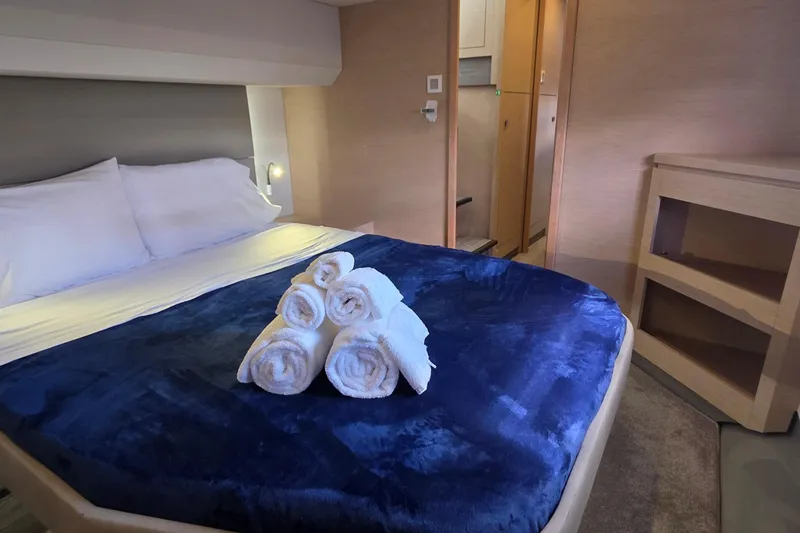 Slide: The Image of Luxurious bedroom interior of 2018 Fountaine Pajot Motor Yacht 44 with plush bedding. - 52