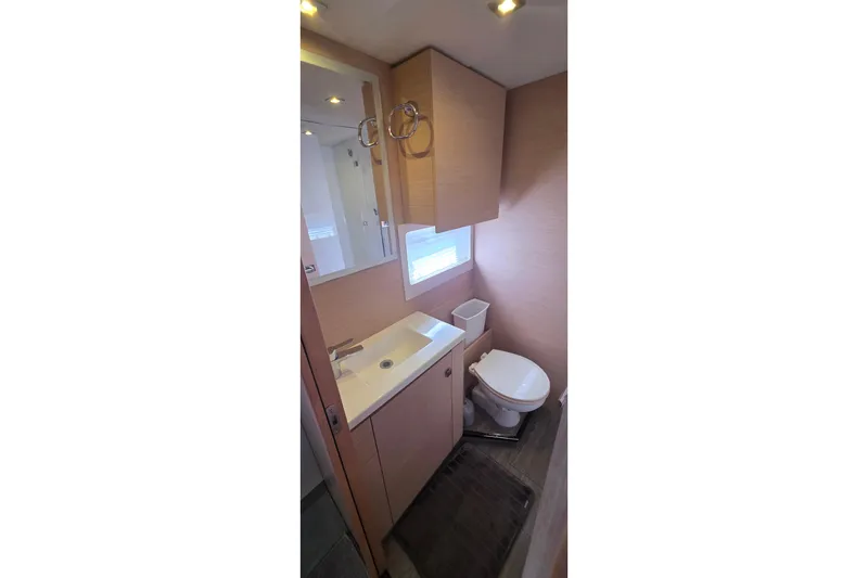 Slide: The Image of Bathroom interior of 2018 Fountaine Pajot Motor Yacht 44, featuring modern fixtures and wood accents. - 54