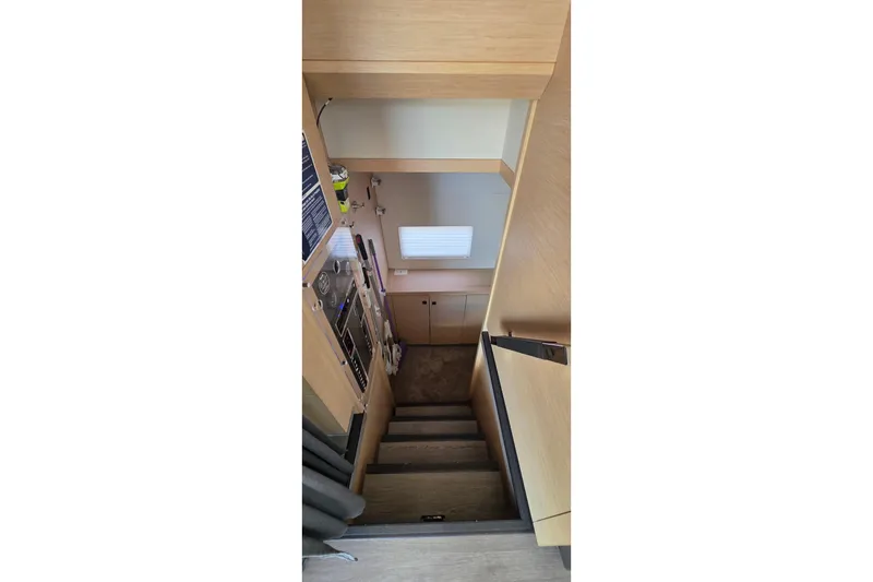 Slide: The Image of Interior stairs of 2018 Fountaine Pajot Motor Yacht 44, featuring modern wood design. - 56