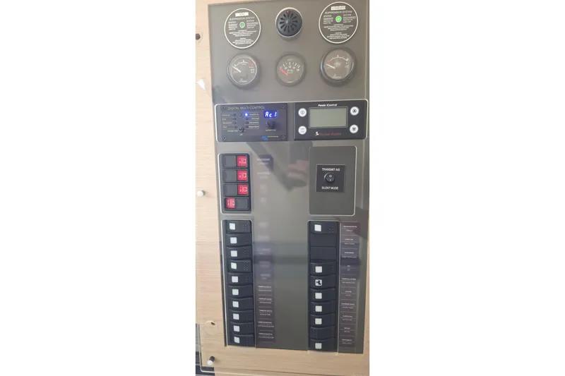 Slide: The Image of Control panel of 2018 Fountaine Pajot Motor Yacht 44, featuring gauges and switches. - 57