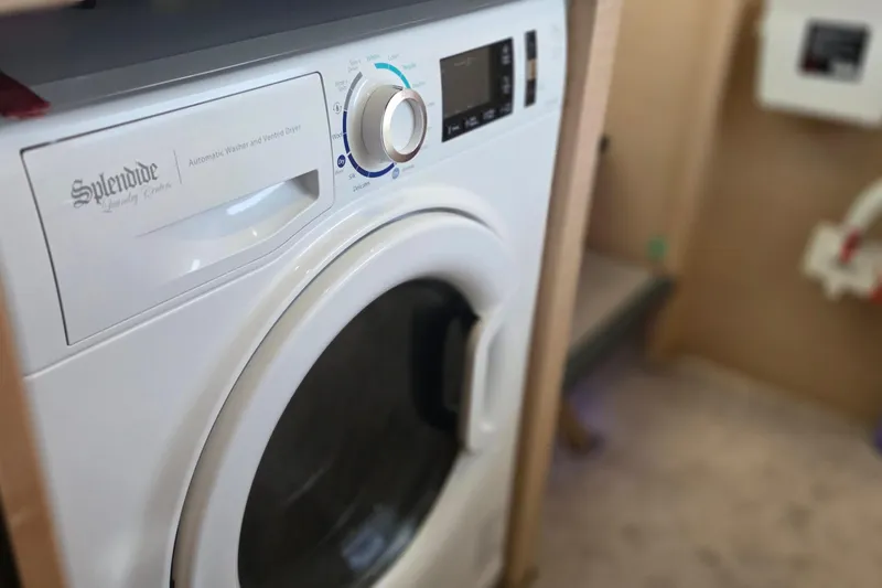Slide: The Image of Splendide washer-dryer inside 2018 Fountaine Pajot Motor Yacht 44 laundry area. - 59