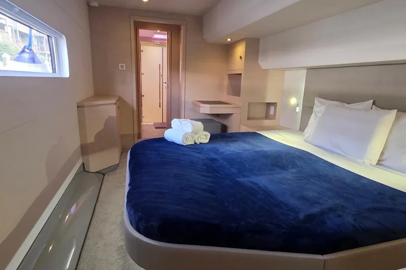 Slide: The Image of Luxurious cabin interior of 2018 Fountaine Pajot Motor Yacht 44 with cozy bedding. - 62