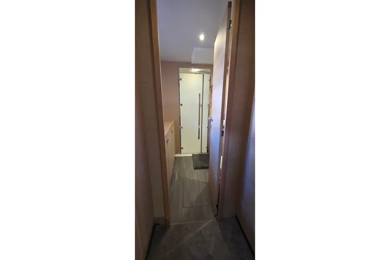 Slide: The Image of Hallway interior of 2018 Fountaine Pajot Motor Yacht 44, featuring modern wood paneling. - 64