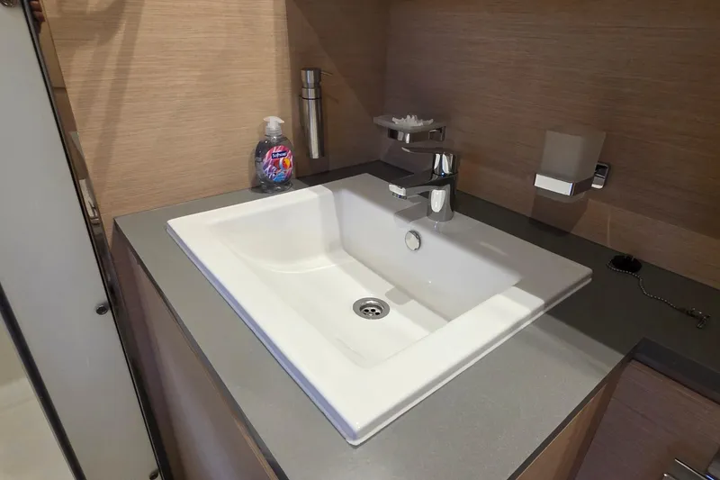 Slide: The Image of Modern bathroom sink on 2018 Fountaine Pajot Motor Yacht 44, featuring sleek design and fixtures. - 67