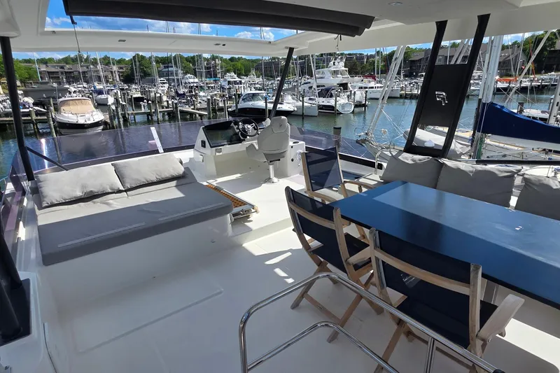 Slide: The Image of Luxurious 2018 Fountaine Pajot Motor Yacht 44 interior with seating and dining area at marina. - 70