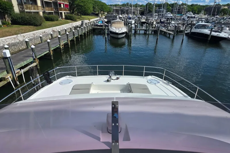 Slide: The Image of 2018 Fountaine Pajot Motor Yacht 44 docked at a marina with scenic waterfront views. - 74