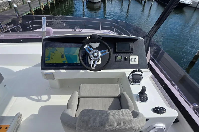 Slide: The Image of Cockpit of 2018 Fountaine Pajot Motor Yacht 44 with navigation controls and steering wheel. - 75
