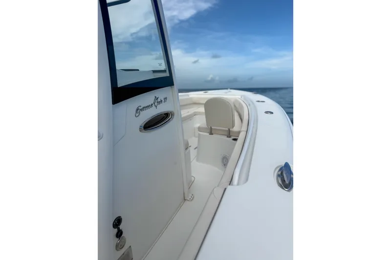 Slide: The Image of 2024 Sea Hunt Gamefish 27 boat with forward seating, ocean backdrop. - 13