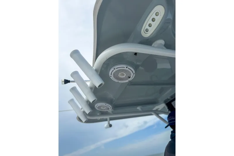 Slide: The Image of 2024 Sea Hunt Gamefish 27 boat roof with rod holders and speakers. - 17