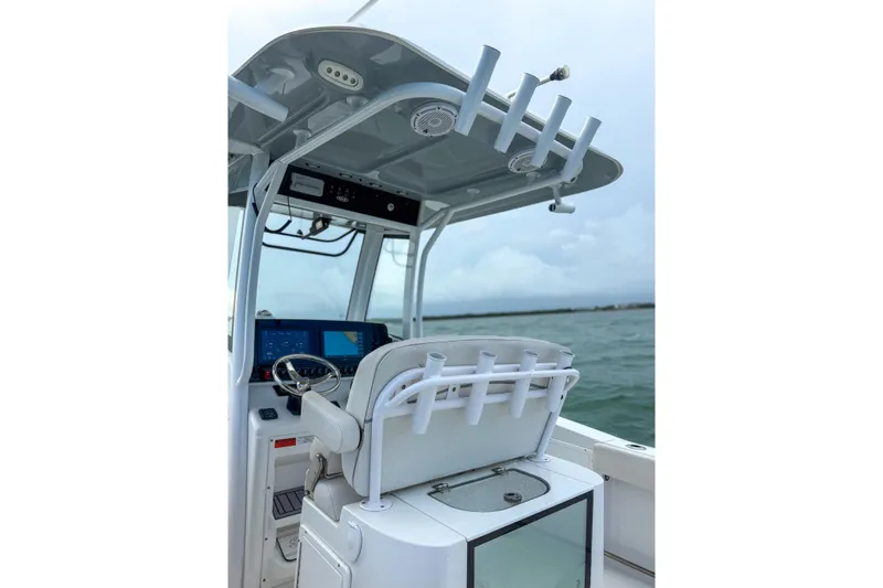 Slide: The Image of 2024 Sea Hunt Gamefish 27 boat interior with advanced navigation system and rod holders. - 19