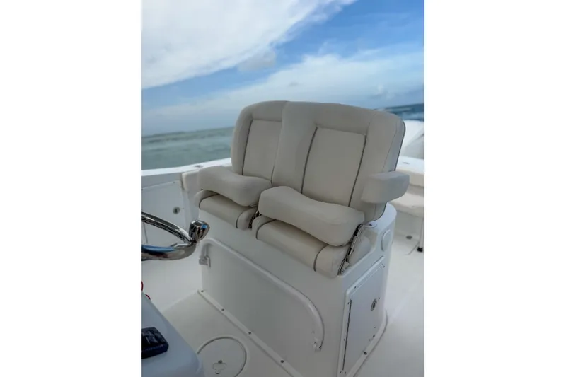 Slide: The Image of 2024 Sea Hunt Gamefish 27 Forward Seating with plush dual helm seats. - 20