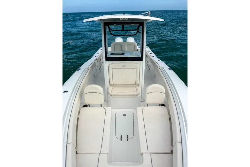 Slide: The Image of 2024 Sea Hunt Gamefish 27 Forward Seating boat on open water. - 22