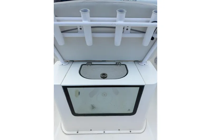 Slide: The Image of 2024 Sea Hunt Gamefish 27 Forward Seating boat with rod holders and storage compartment. - 27