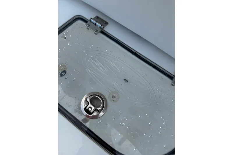 Slide: The Image of 2024 Sea Hunt Gamefish 27 Forward Seating hatch with water droplets. - 28