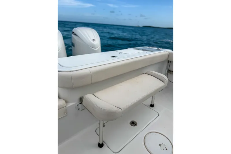 Slide: The Image of 2024 Sea Hunt Gamefish 27 boat with forward seating, ocean backdrop. - 30