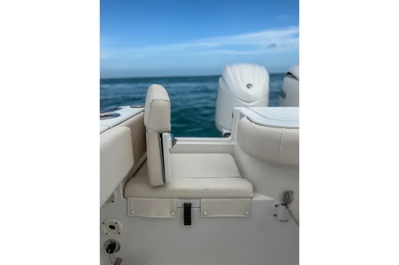 Slide: The Image of 2024 Sea Hunt Gamefish 27 boat with forward seating, ocean backdrop. - 32