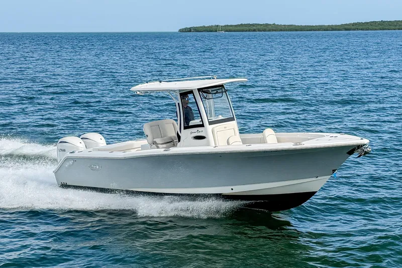 Slide: The Image of 2024 Sea Hunt Gamefish 27 Forward Seating cruising on open water. - 4
