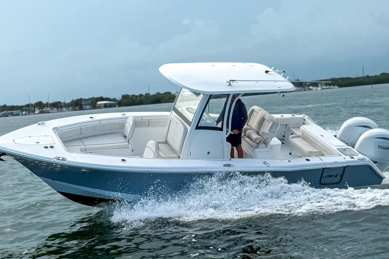 Slide: The Image of 2024 Sea Hunt Gamefish 27 Forward Seating boat cruising on water. - 6