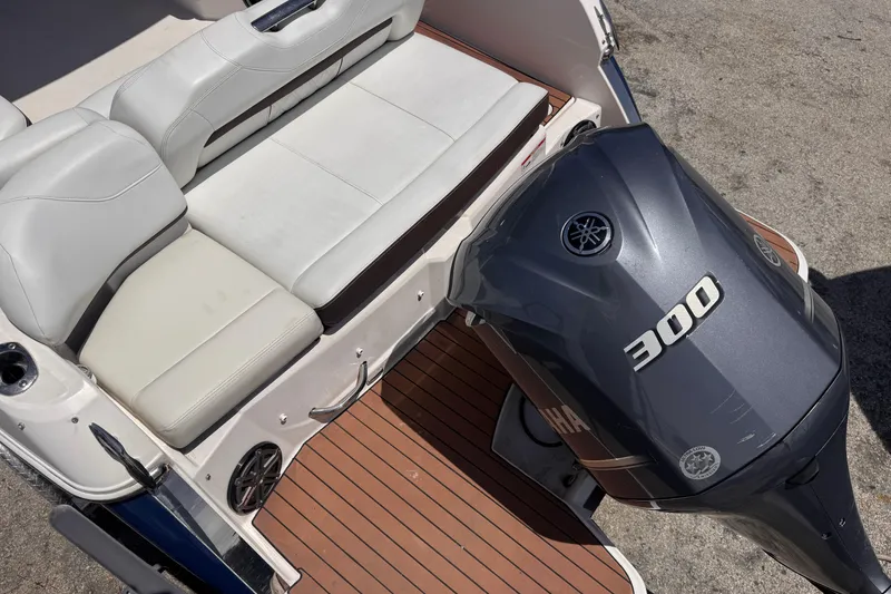 Slide: The Image of 2018 Regal 26 OBX boat with Yamaha 300 outboard motor and white seating. - 10