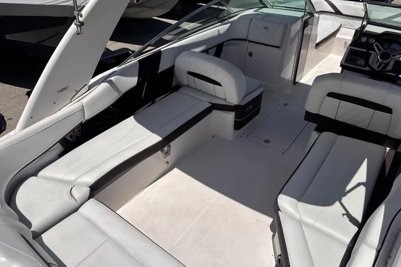 Slide: The Image of Interior view of a 2018 Regal 26 OBX boat with white seating and sleek design. - 11