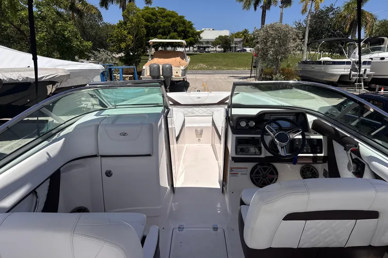 Slide: The Image of 2018 Regal 26 OBX boat interior with sleek dashboard and comfortable seating. - 12