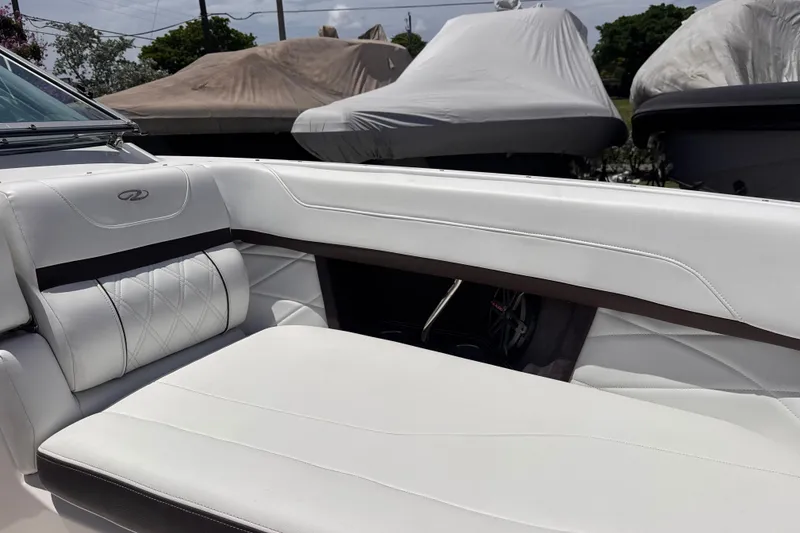 Slide: The Image of Interior of a 2018 Regal 26 OBX boat with white leather seating. - 18