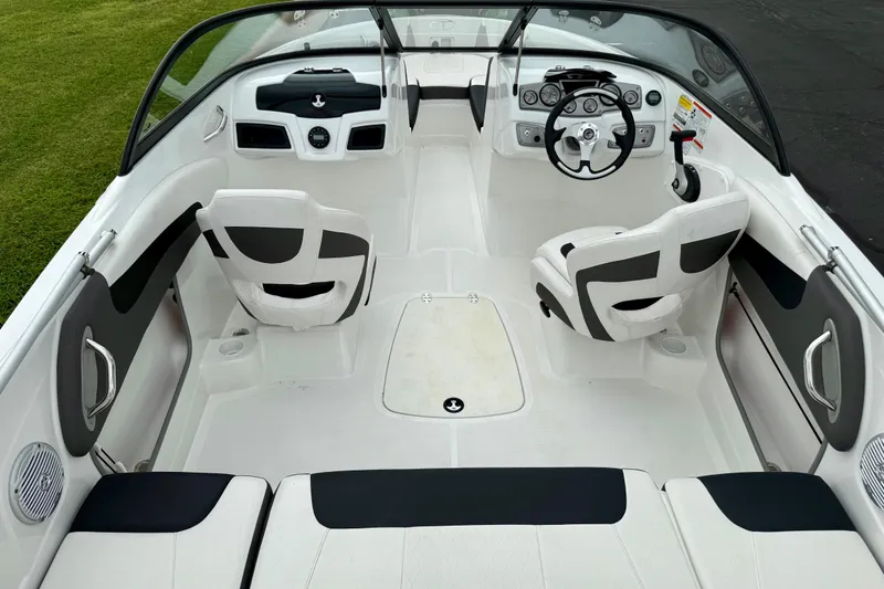 Slide: The Image of 2024 Tahoe 200 S boat interior with sleek white seating and modern dashboard design. - 3