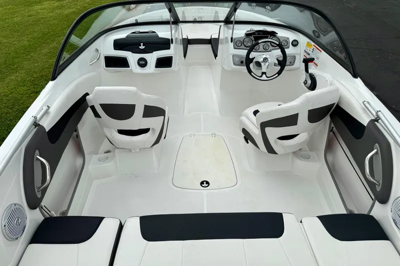 Slide: The Image of 2024 Tahoe 200 S boat interior with sleek seating and modern dashboard design. - 4