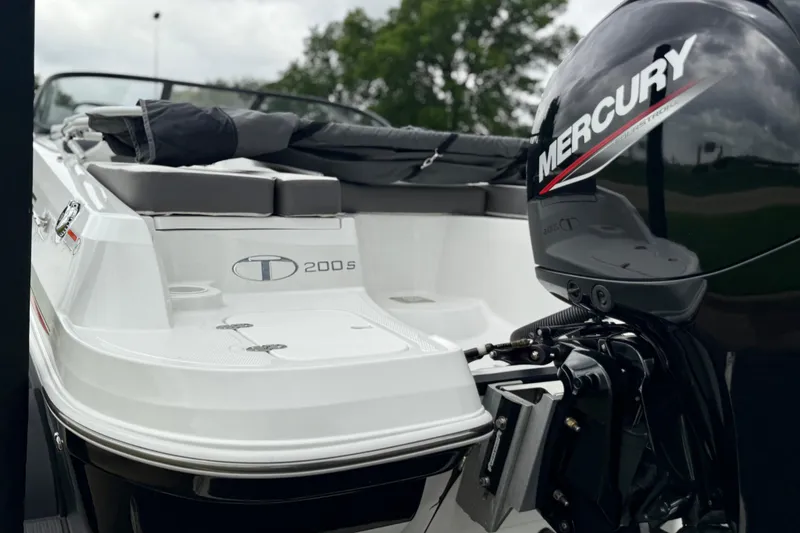 Slide: The Image of 2024 Tahoe 200 S boat with Mercury outboard motor, rear view. - 7
