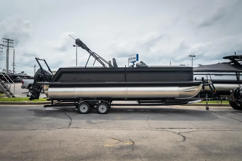 The Image of 2026 Viaggio Lago X-U 24 pontoon boat on trailer, parked outdoors. - 1