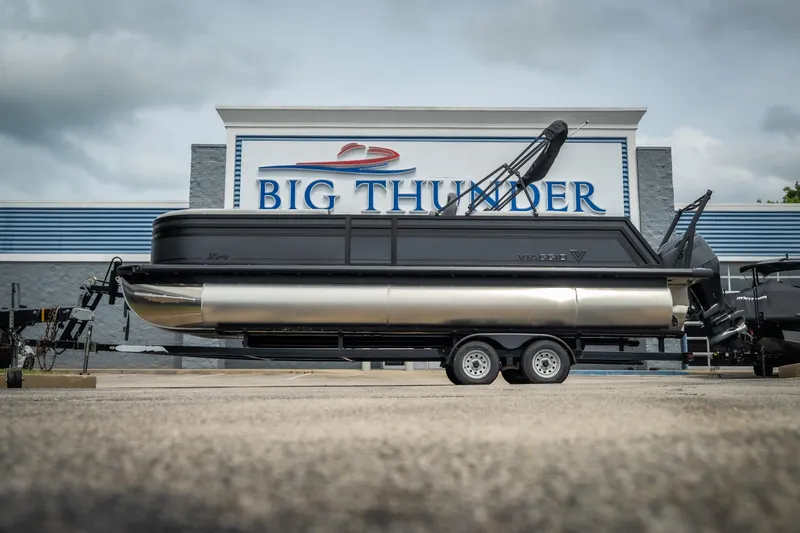 Slide: The Image of 2026 Viaggio Lago X-U 24 pontoon boat on trailer at Big Thunder dealership. - 11