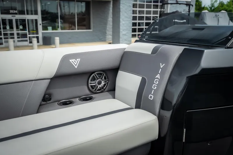 Slide: The Image of Interior of 2026 Viaggio Lago X-U 24 boat with sleek seating and speaker system. - 18