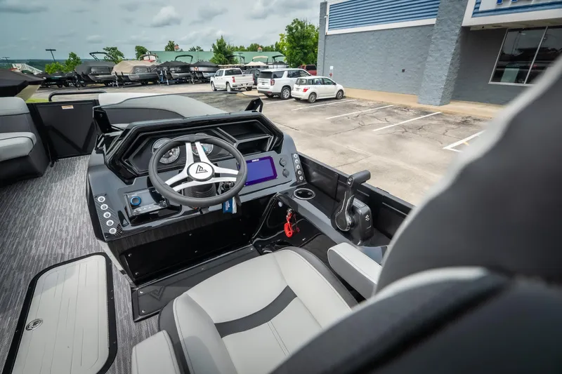Slide: The Image of Viaggio Lago X-U 24 boat interior, 2026 model, featuring modern steering and control panel. - 23
