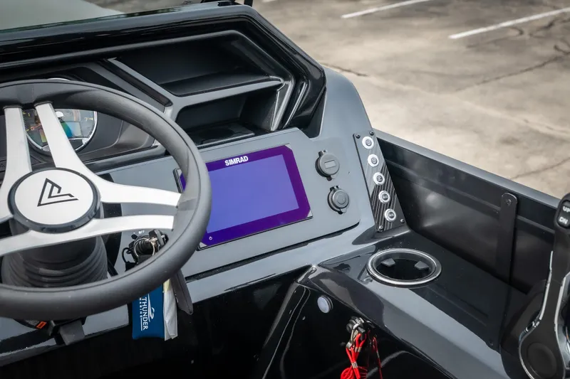 Slide: The Image of Steering console of 2026 Viaggio Lago X-U 24 with Simrad display and modern controls. - 25