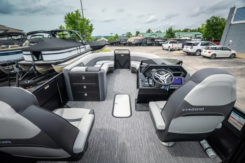 Slide: The Image of 2026 Viaggio Lago X-U 24 pontoon boat interior with modern seating and steering console. - 28