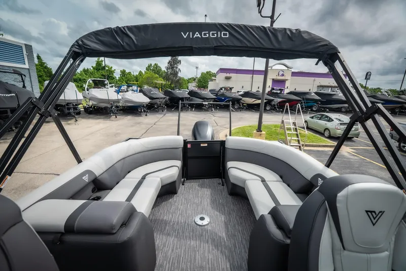 Slide: The Image of 2026 Viaggio Lago X-U 24 pontoon boat with sleek seating, displayed outdoors. - 30