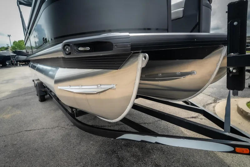 Slide: The Image of 2026 Viaggio Lago X-U 24 pontoon boat on trailer, showcasing sleek aluminum pontoons. - 4