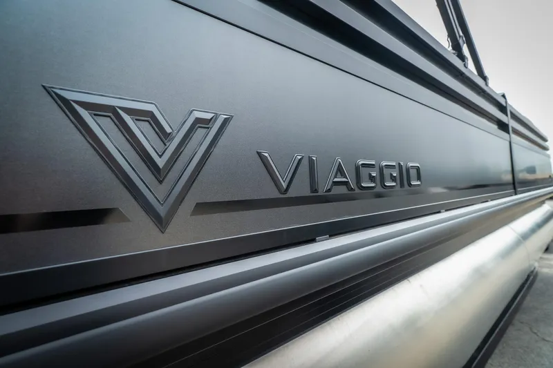 Slide: The Image of 2026 Viaggio Lago X-U 24 boat, sleek design with embossed logo detail. - 6