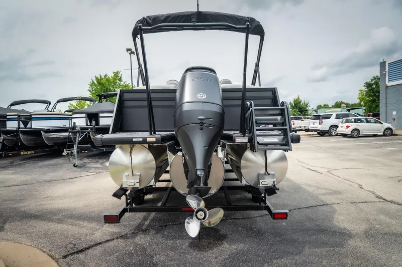 Slide: The Image of 2026 Viaggio Lago X-U 24 pontoon boat with powerful outboard motor in a dealership lot. - 8