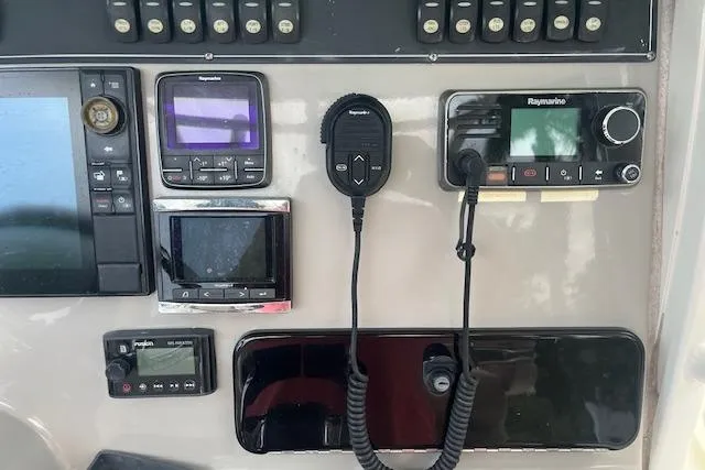 Slide: The Image of Control panel of a 2016 Boston Whaler 270 Dauntless with navigation and communication equipment. - 16