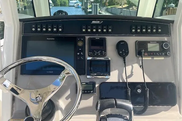 Slide: The Image of Control panel of a 2016 Boston Whaler 270 Dauntless boat with navigation equipment. - 20