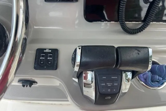 Slide: The Image of Control panel of a 2016 Boston Whaler 270 Dauntless boat with throttle and trim tabs. - 3