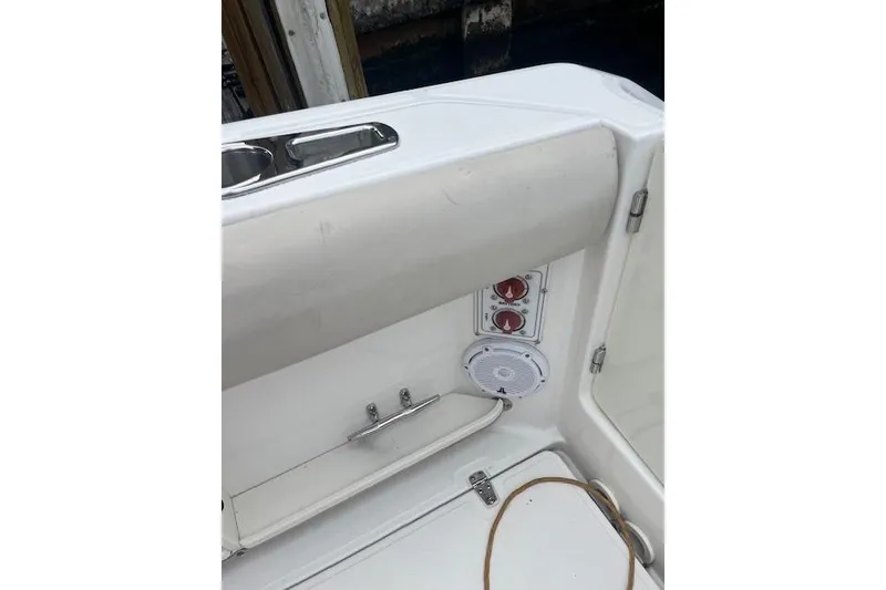 Slide: The Image of 2016 Boston Whaler 270 Dauntless boat interior with speaker and control panel. - 11