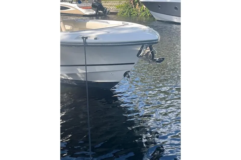 Slide: The Image of 2016 Boston Whaler 270 Dauntless boat docked on calm water. - 17
