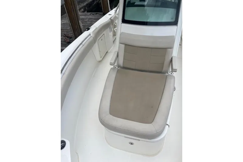 Slide: The Image of 2016 Boston Whaler 270 Dauntless boat seat with beige upholstery and sleek design. - 5